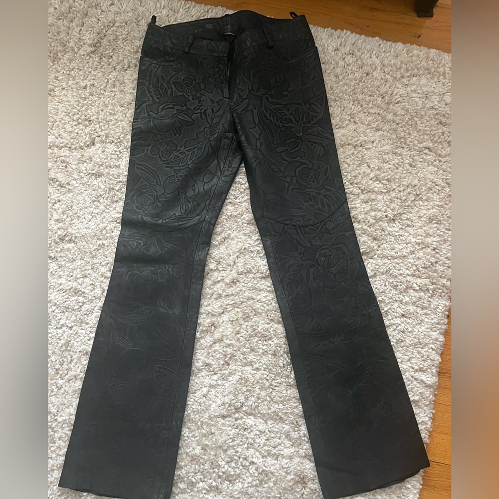 Express printed black leather flare pants.